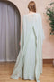 Back image of a model wearing the Lailah maxi dress in sage, by brand Tfnc