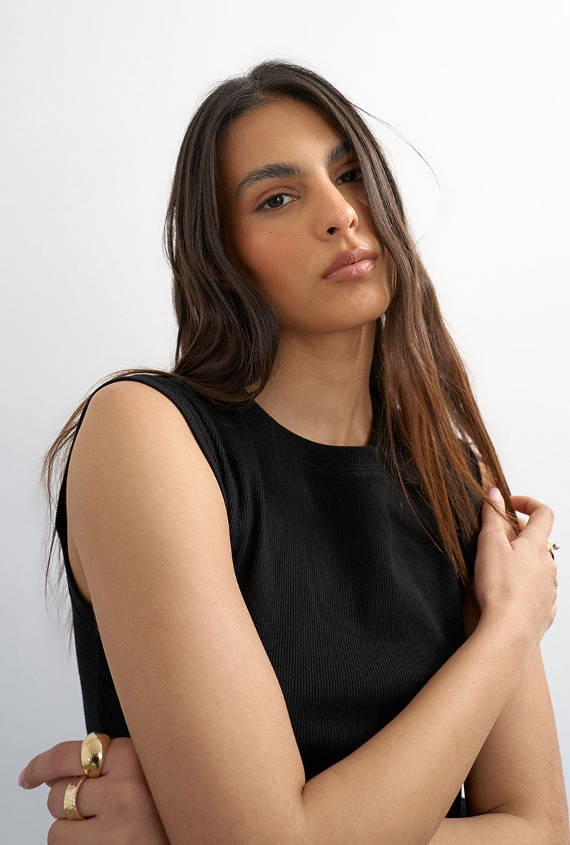 Front image of a model wearing Adela sl rib boyfriend tank top in black, by brand Top shop