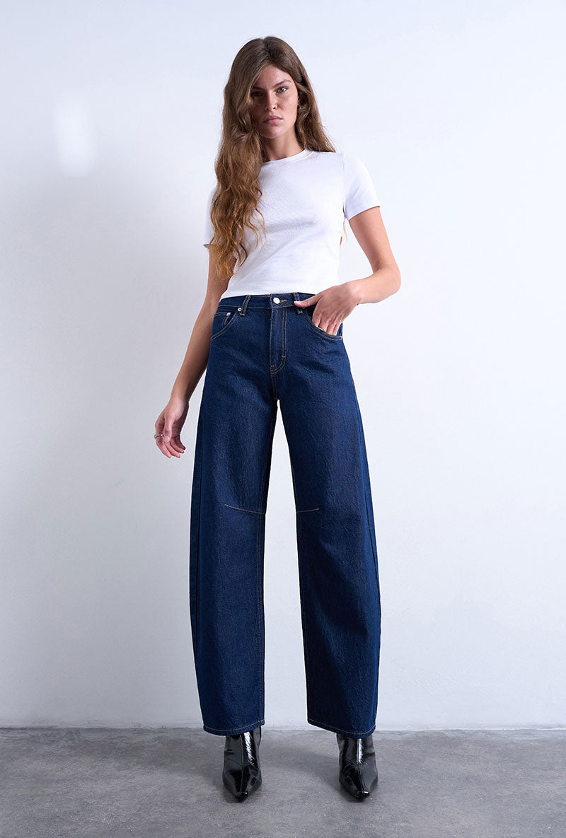 Front image of a model wearing Barrel hr denim jeans in dark denim, by brand Top shop