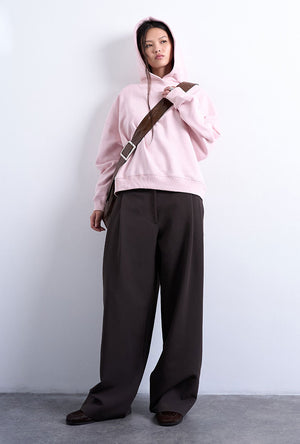 Front image of a model wearing the Bibi ls ultimate hoodie in pink, by brand Top shop