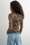Back image of a model wearing the Beate ls crewneck mesh top in black, by brand Top shop