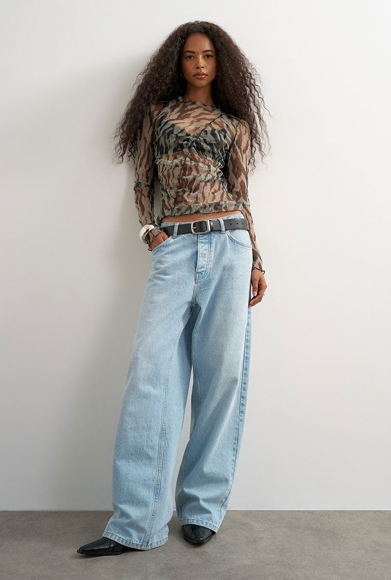 Front image of a model wearing Beate ls crewneck mesh top in black, by brand Top shop
