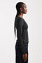 Front image of a model wearing the Belma l/s oneck sheer top in black, by brand Top shop