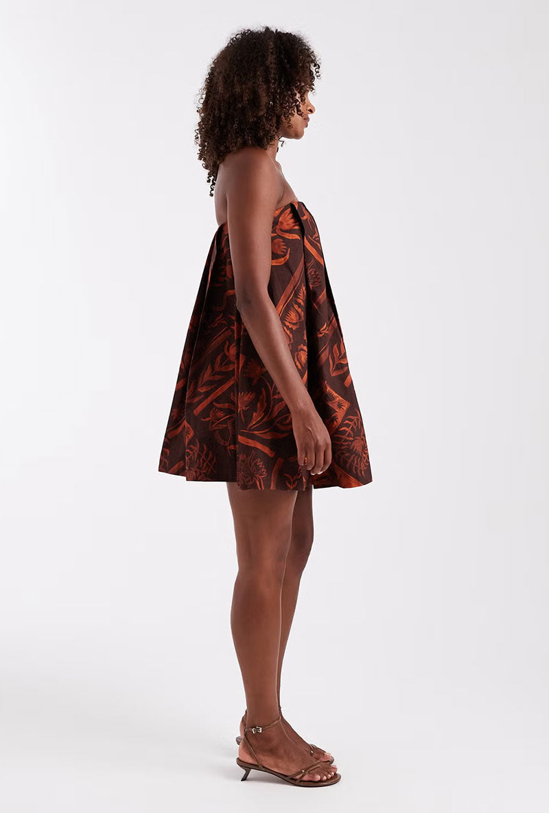 Front image of a model wearing Calla bandeau mini dress in rust, by brand Top shop