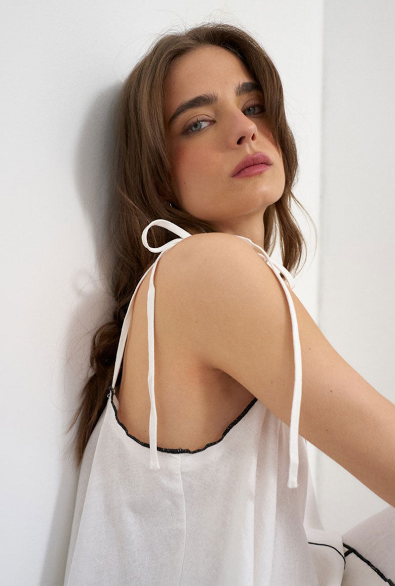 Front image of a model wearing Caro cami top in off white, by brand Top shop