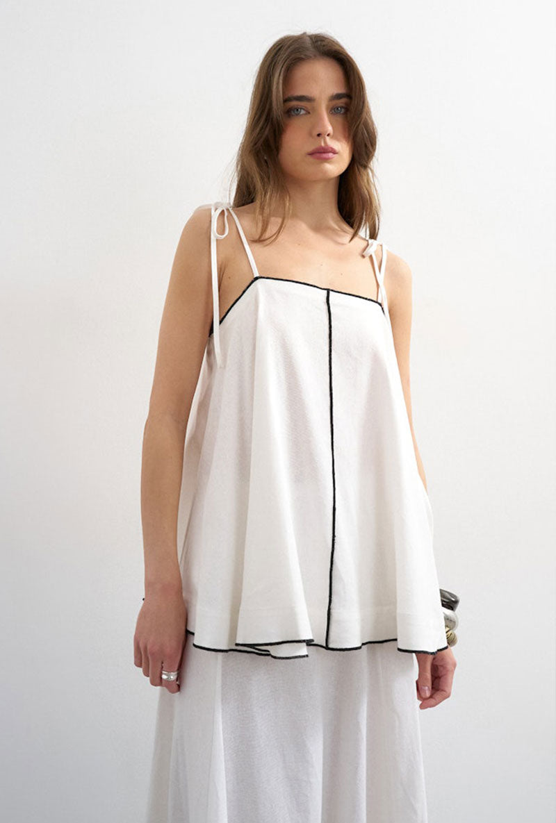 Front image of a model wearing Caro cami top in off white, by brand Top shop