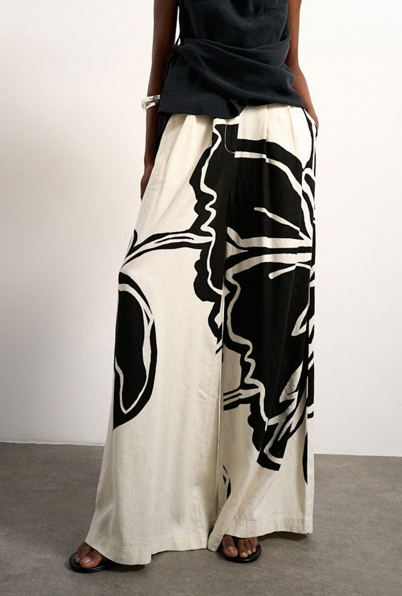 Front image of a model wearing Fiona wide leg trousers in off white, by brand Top shop