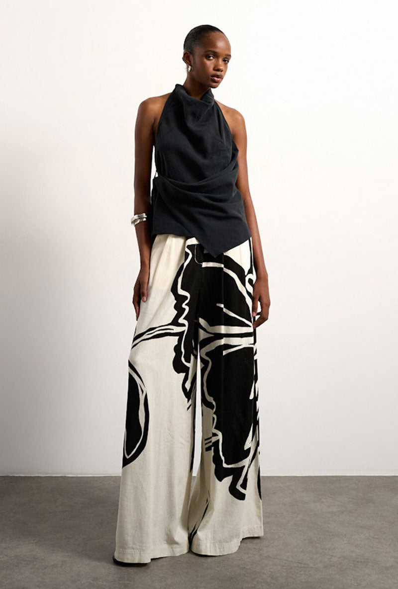 Front image of a model wearing Fiona wide leg trousers in off white, by brand Top shop