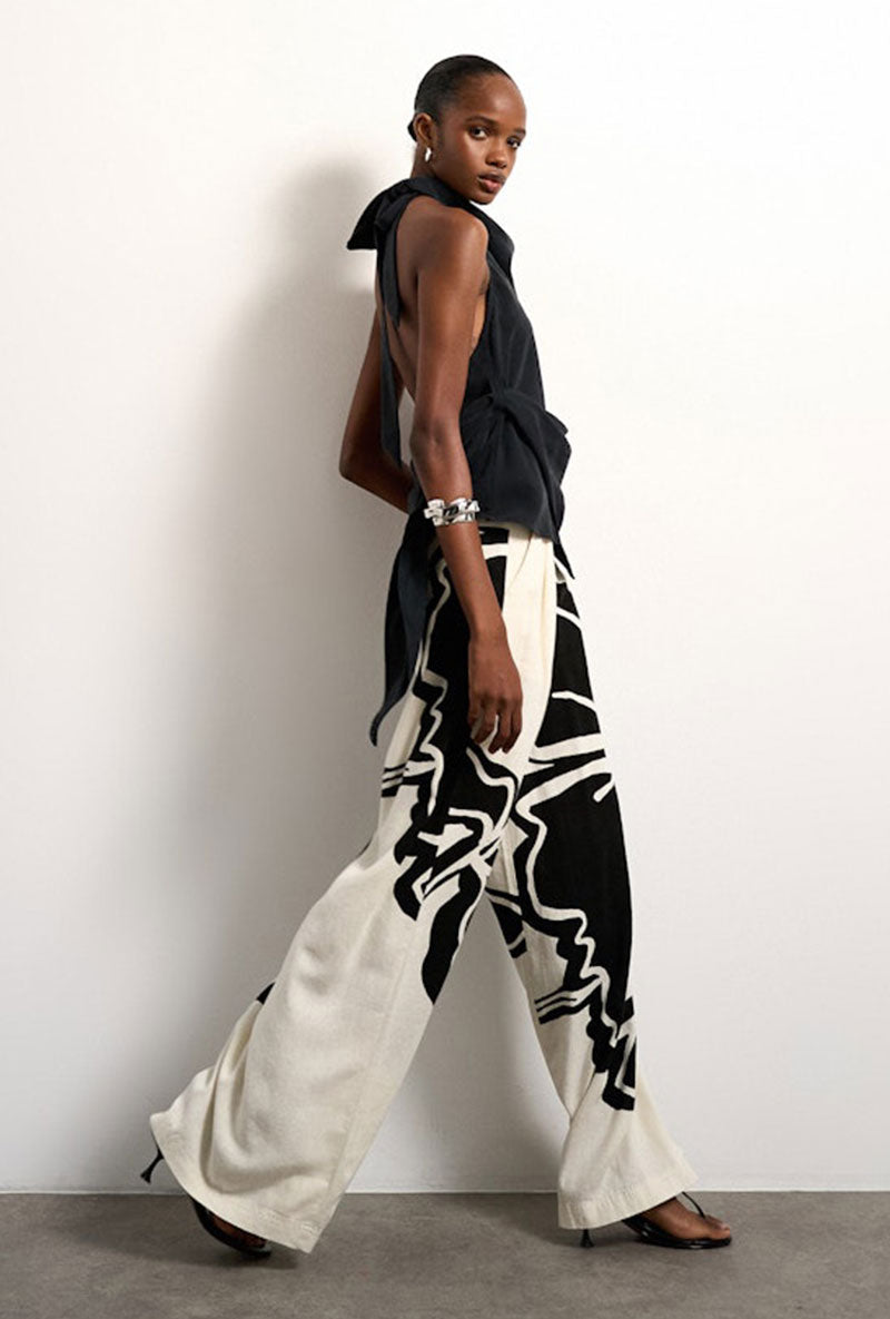 Front image of a model wearing Fiona wide leg trousers in off white, by brand Top shop
