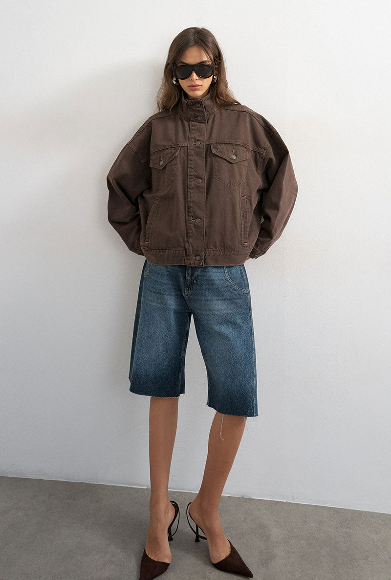 Front image of a model wearing Freya denim jacket in brown, by brand Top shop