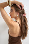 Back image of a model wearing the Marta one shoulder top in brown, by brand Top shop