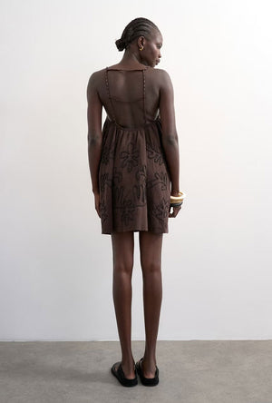 Back image of a model wearing the Mia trapeze mini dress in chocolate, by brand Top shop