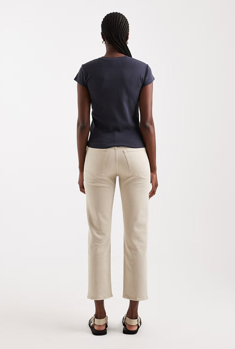 Back image of a model wearing Orson mid rise jeans in beige, by brand Top shop