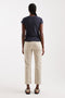 Back image of a model wearing the Orson mid rise jeans in beige, by brand Top shop