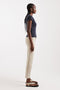 Front image of a model wearing the Orson mid rise jeans in beige, by brand Top shop