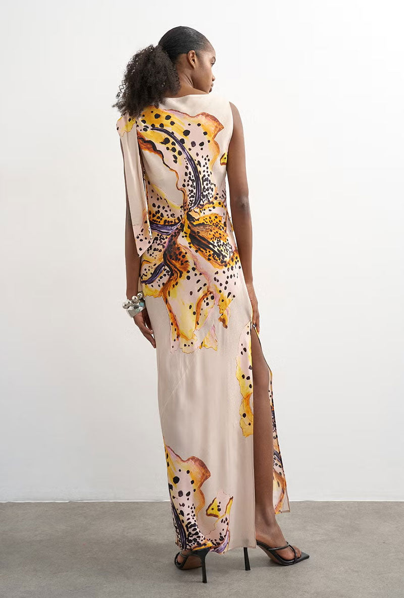 Back image of a model wearing Vana tie neck maxi dress in beige, by brand Top shop