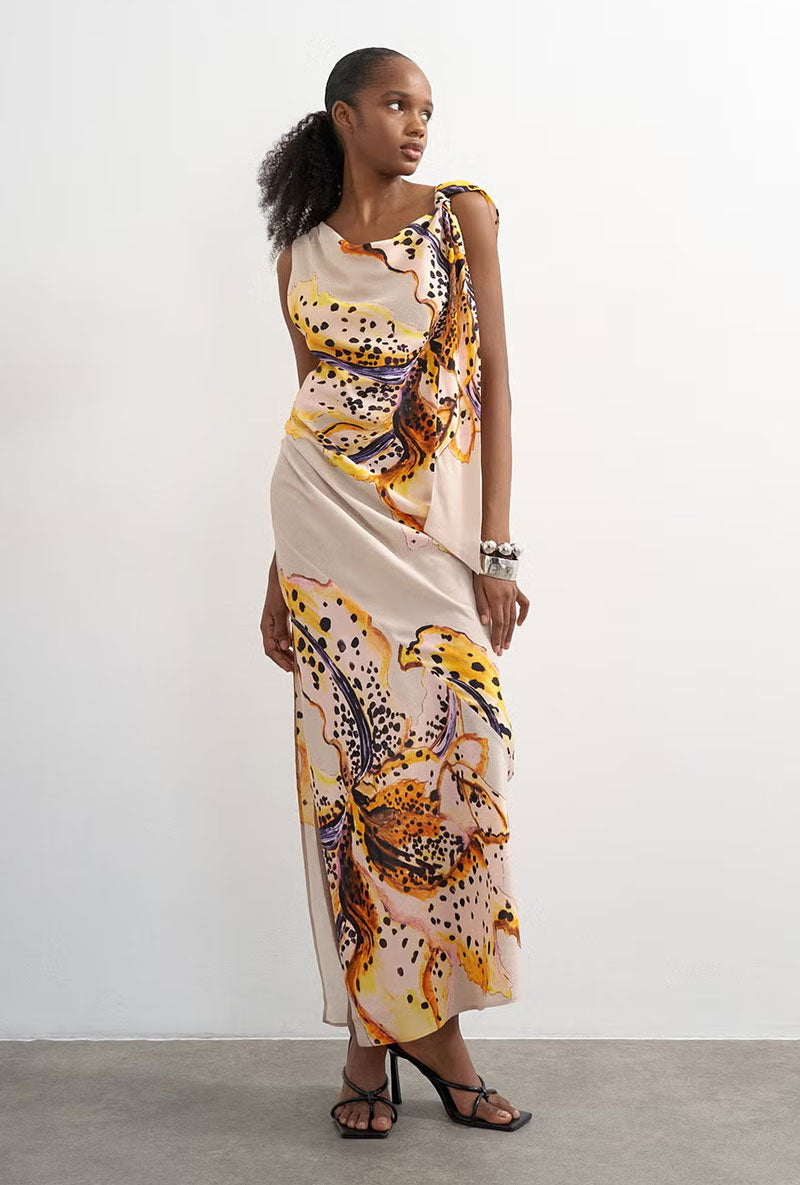 Front image of a model wearing Vana tie neck maxi dress in beige, by brand Top shop