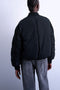 Back image of a model wearing the Vera bomber in black, by brand Top shop