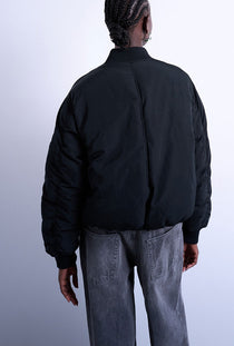 Back image of a model wearing the Vera bomber in black, by brand Top shop