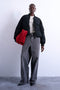 Front image of a model wearing the Vera bomber in black, by brand Top shop