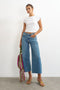 Front image of a model wearing the Vera hr wide cropped jeans in denim, by brand Top shop