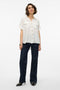 Front image of a model wearing the Bumpy ss shirt in white, by brand Vero moda
