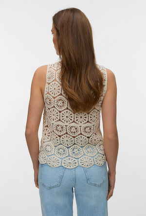 Back image of a model wearing the Elsa sl crop top in beige, by brand Vero moda