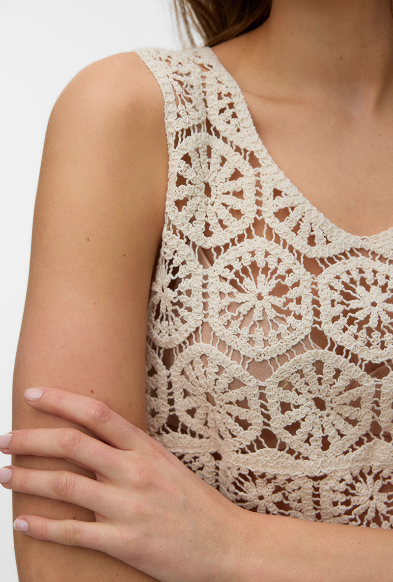 Front image of a model wearing Elsa sl crop top in beige, by brand Vero moda