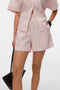 Front image of a model wearing the Glow hw shorts in pink, by brand Vero moda