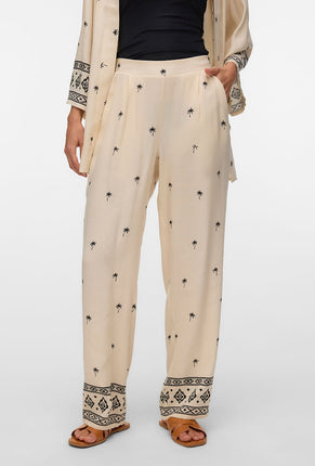 Front image of a model wearing Kai mw pants in beige, by brand Vero moda