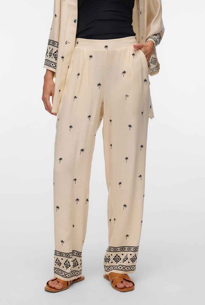 Front image of a model wearing Kai mw pants in beige, by brand Vero moda
