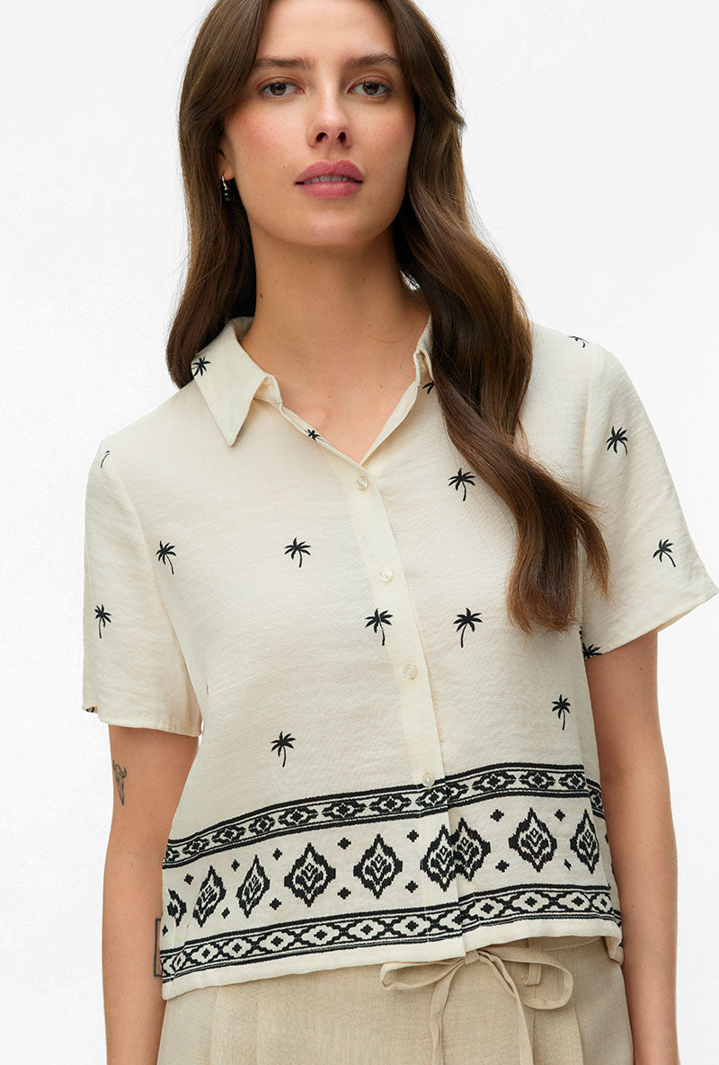 Front image of a model wearing Kai s/s shirt in beige, by brand Vero moda
