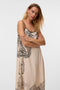 Front image of a model wearing the Lalita zola ankle dress in beige, by brand Vero moda