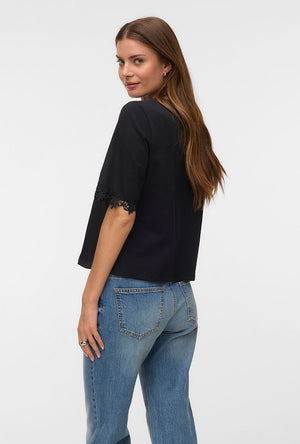 Back image of a model wearing the Lyla ss oneck top in black, by brand Vero moda
