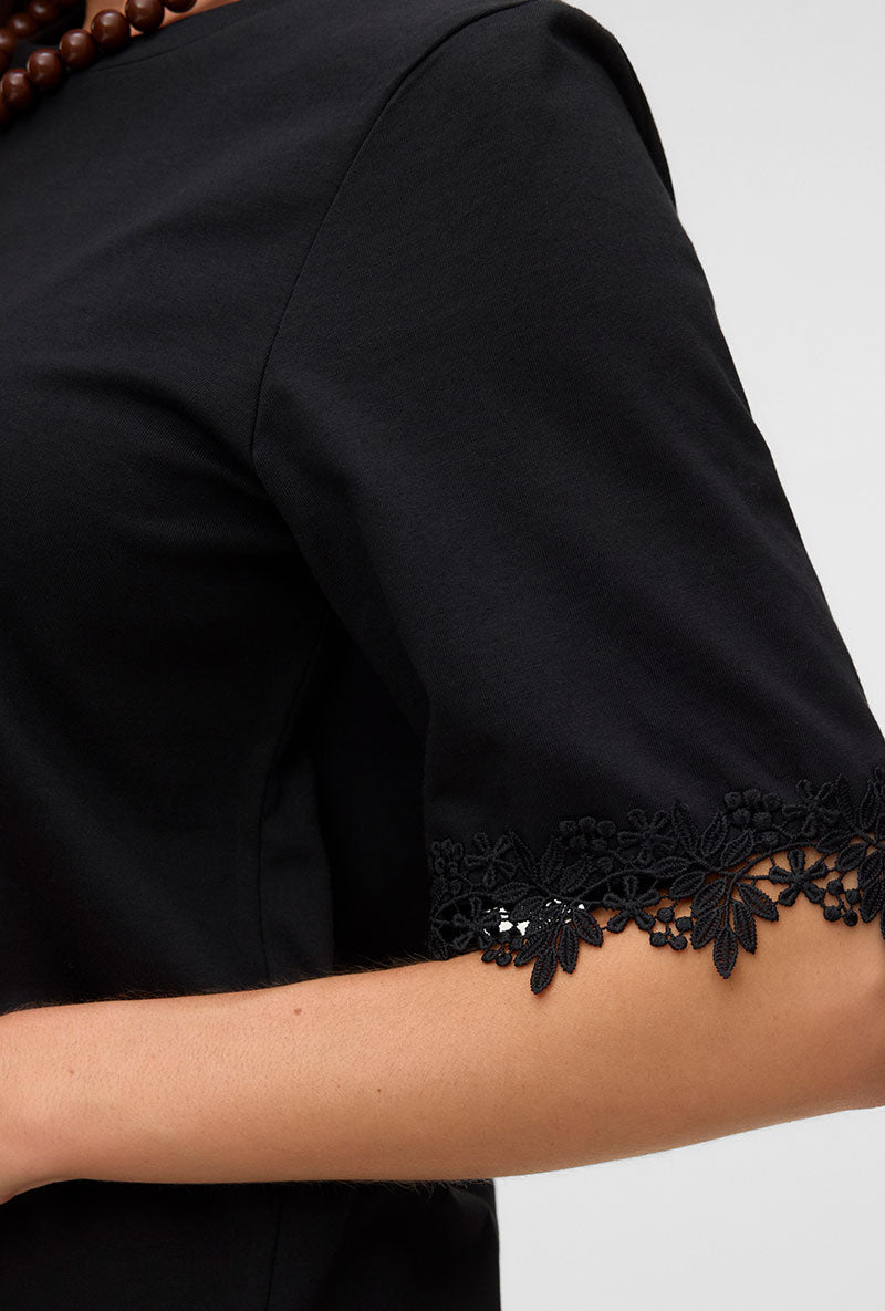 Front image of a model wearing Lyla ss oneck top in black, by brand Vero moda