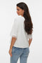 Back image of a model wearing the Lyla ss oneck top in white, by brand Vero moda
