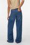 Back image of a model wearing the Rae hw wide jeans in denim, by brand Vero moda