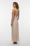 Back image of a model wearing the Reba hibisca ankle dress in beige, by brand Vero moda