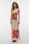 Front image of a model wearing the Reba hibisca ankle dress in beige, by brand Vero moda
