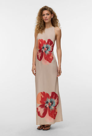 Front image of a model wearing the Reba hibisca ankle dress in beige, by brand Vero moda