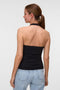 Back image of a model wearing the Valerie halterneck top in black, by brand Vero moda