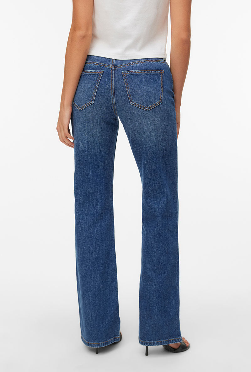 Back image of a model wearing Asta lr bootcut jeans in denim, by brand Vero moda