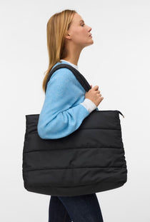 Front image of a model wearing the Balloon bag in black, by brand Vero moda