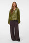 Front image of a model wearing Dash short coated jacket in green, by brand Vero moda