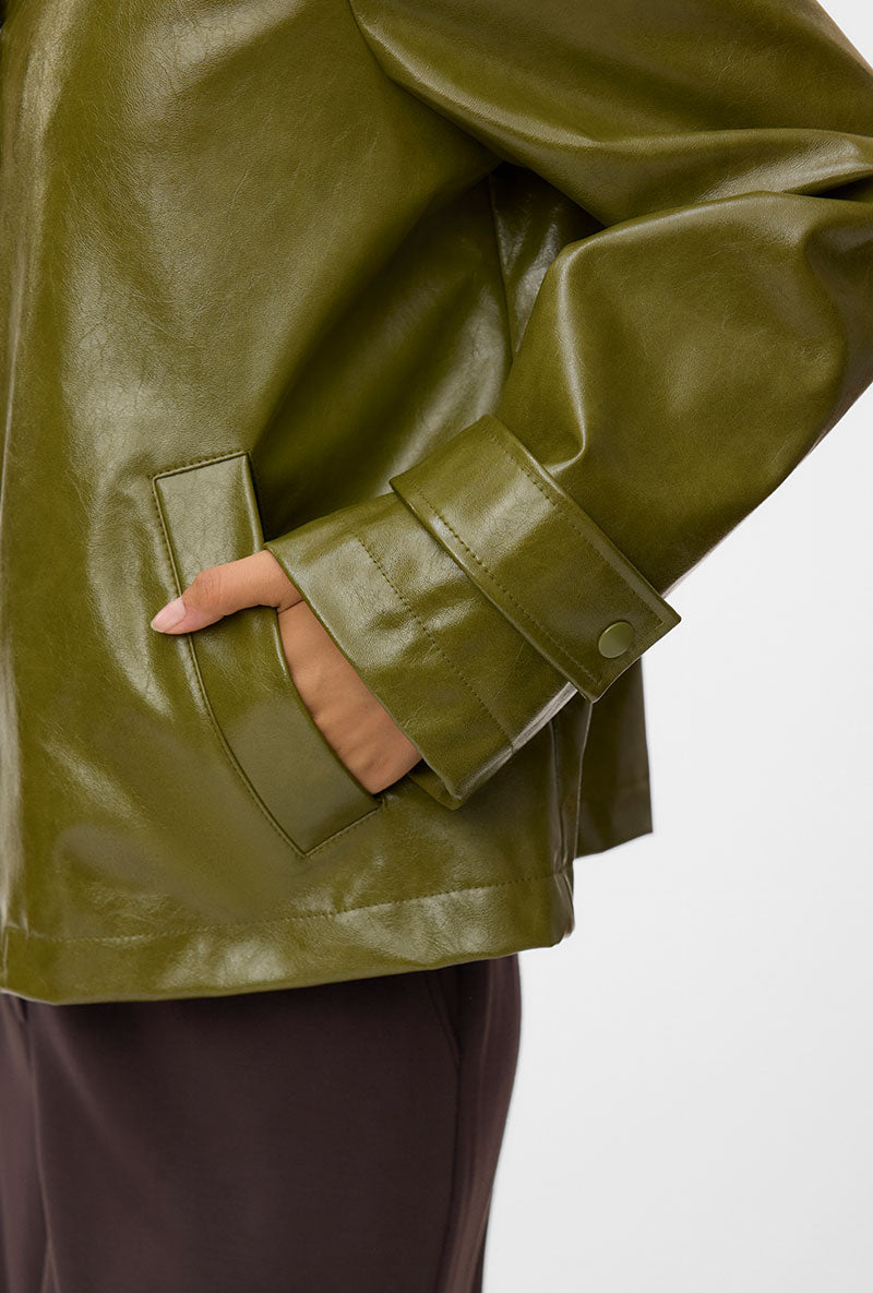 Front image of a model wearing Dash short coated jacket in green, by brand Vero moda