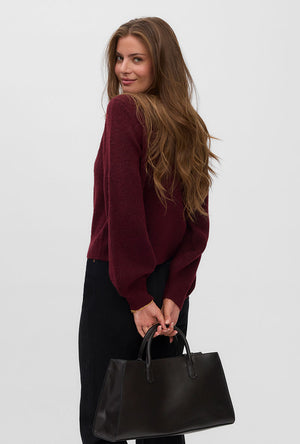 Back image of a model wearing the Hazel ls oneck cardigan in burgundy, by brand Vero moda