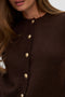 Front image of a model wearing the Hazel ls oneck cardigan in chocolate, by brand Vero moda