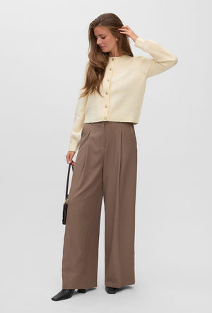 Front image of a model wearing the Hazel ls oneck cardigan in cream, by brand Vero moda
