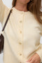 Front image of a model wearing the Hazel ls oneck cardigan in cream, by brand Vero moda