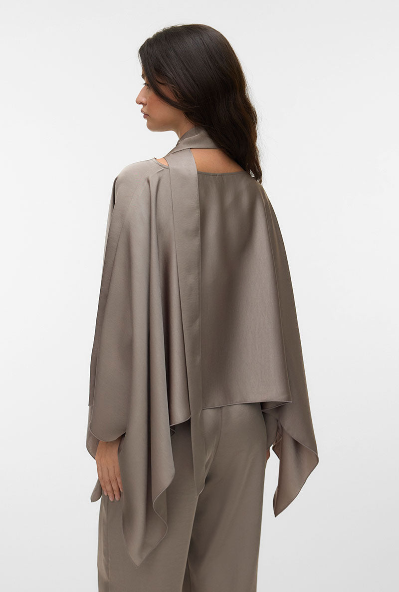 Back image of a model wearing Miro ls cape scarf top in bronze, by brand Vero moda
